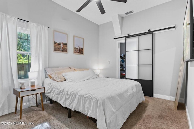 3040 Rosselle St, Jacksonville, FL 32205 - bedroom featuring a barn door, carpet, and ceiling fan