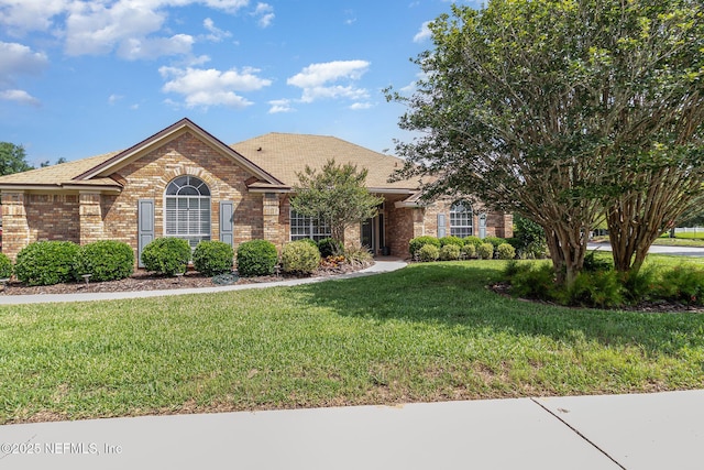 12373 Shell Beach Trl, Jacksonville, FL 32246 - view of front of home with brick siding and a front yard