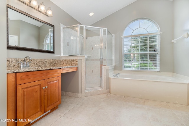 12373 Shell Beach Trl, Jacksonville, FL 32246 - bathroom with vanity, healthy amount of natural light, a garden tub, and a stall shower