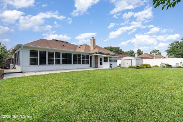 12373 Shell Beach Trl, Jacksonville, FL 32246 - back of property with a sunroom, a shed, a chimney, and a patio area