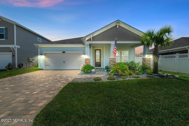 154 Pine Candle Way, Saint Augustine, FL 32092 - craftsman-style house with decorative driveway, an attached garage, a porch, and stone siding