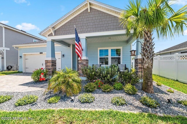154 Pine Candle Way, Saint Augustine, FL 32092 - craftsman-style house with an attached garage, driveway, covered porch, and stone siding