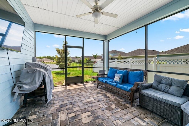 154 Pine Candle Way, Saint Augustine, FL 32092 - sunroom with outdoor lounge area, a ceiling fan, and a residential view