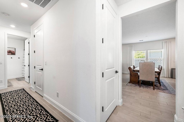 154 Pine Candle Way, Saint Augustine, FL 32092 - hall with light wood-style flooring, baseboards, and recessed lighting