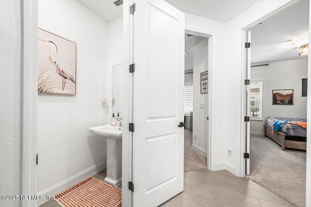 154 Pine Candle Way, Saint Augustine, FL 32092 - bathroom featuring wood finished floors and baseboards