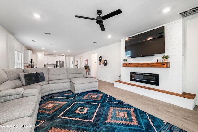 154 Pine Candle Way, Saint Augustine, FL 32092 - living area featuring ceiling fan, wood finished floors, a large fireplace, baseboards, and recessed lighting