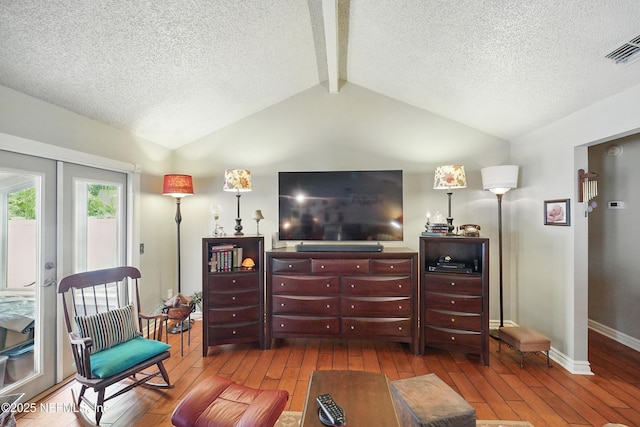 11019 Crumpet Ct, Jacksonville, FL 32257 - living room with hardwood / wood-style flooring, french doors, a textured ceiling, and baseboards