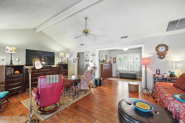 11019 Crumpet Ct, Jacksonville, FL 32257 - living area featuring hardwood / wood-style flooring, a textured ceiling, and a ceiling fan