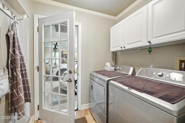11019 Crumpet Ct, Jacksonville, FL 32257 - laundry room featuring washing machine and clothes dryer, cabinet space, a textured ceiling, ornamental molding, and baseboards