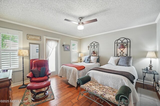 11019 Crumpet Ct, Jacksonville, FL 32257 - bedroom with hardwood / wood-style flooring, crown molding, ceiling fan, a textured ceiling, and baseboards