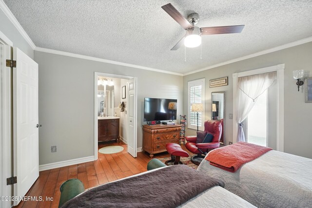 11019 Crumpet Ct, Jacksonville, FL 32257 - bedroom featuring wood-type flooring, a textured ceiling, crown molding, baseboards, and ceiling fan