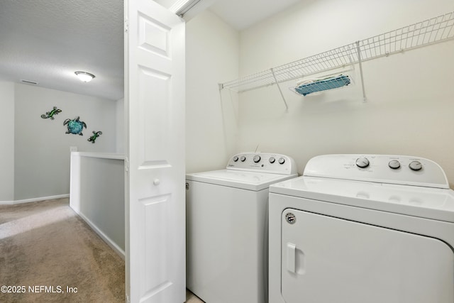 3724 Windmaker Way, Jacksonville, FL 32224 - laundry area featuring light colored carpet, washing machine and clothes dryer, and baseboards