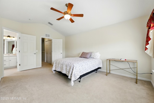 3724 Windmaker Way, Jacksonville, FL 32224 - bedroom with lofted ceiling, light colored carpet, baseboards, connected bathroom, and ceiling fan