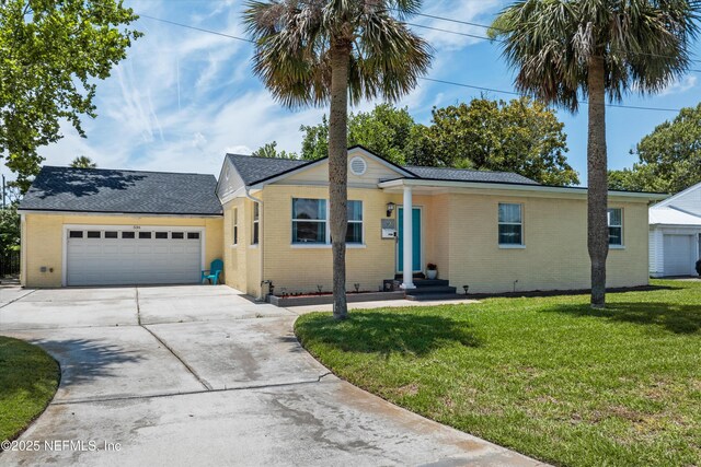 536 14th Ave N, Jacksonville Beach, FL 32250 - ranch-style home featuring driveway, a garage, brick siding, and a front yard