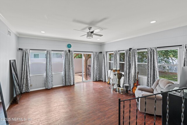 536 14th Ave N, Jacksonville Beach, FL 32250 - living area featuring a ceiling fan, healthy amount of natural light, ornamental molding, wood finished floors, and baseboards