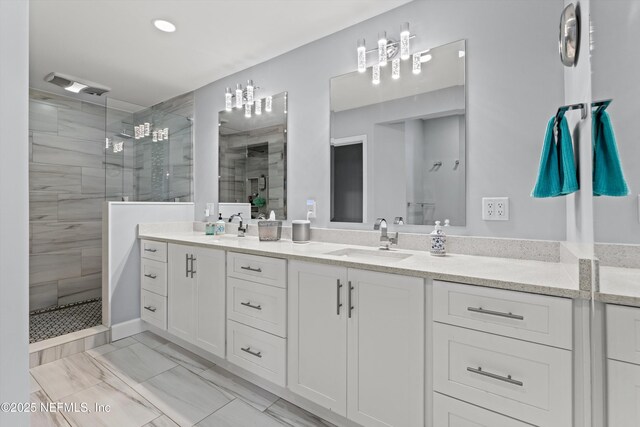 536 14th Ave N, Jacksonville Beach, FL 32250 - full bathroom with double vanity, a shower stall, recessed lighting, and marble look tile flooring