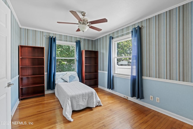 536 14th Ave N, Jacksonville Beach, FL 32250 - bedroom featuring wallpapered walls, wood finished floors, multiple windows, ornamental molding, and baseboards