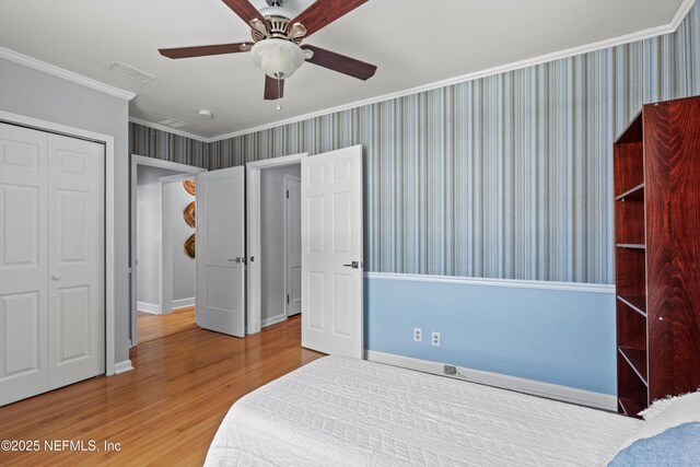 536 14th Ave N, Jacksonville Beach, FL 32250 - bedroom with wallpapered walls, ornamental molding, wood finished floors, a closet, and baseboards