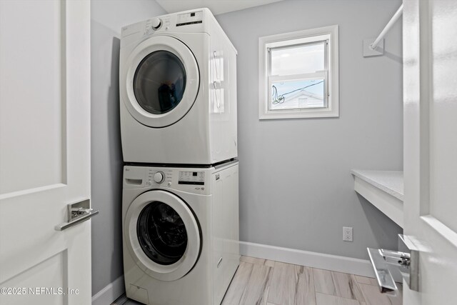 536 14th Ave N, Jacksonville Beach, FL 32250 - laundry area with stacked washing machine and dryer and baseboards