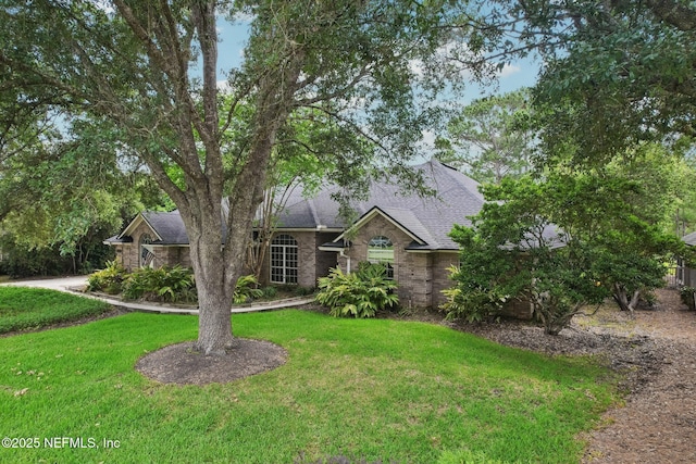 2478 Country Club Blvd, Orange Park, FL 32073 - view of front of home featuring a front lawn and roof with shingles