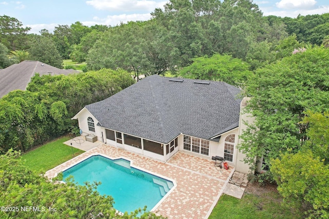 2478 Country Club Blvd, Orange Park, FL 32073 - outdoor pool with a patio area, a forest view, and a lawn