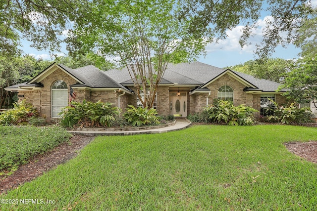 2478 Country Club Blvd, Orange Park, FL 32073 - view of front facade featuring a front lawn, a shingled roof, and brick siding