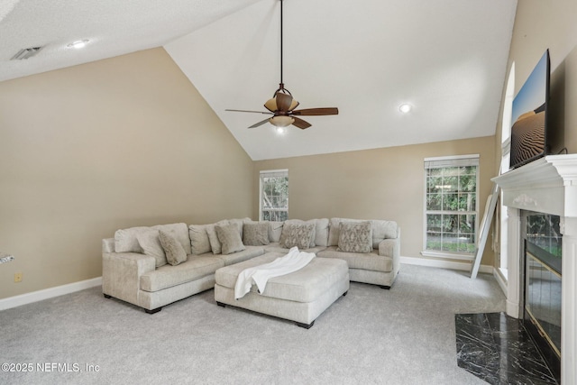 2478 Country Club Blvd, Orange Park, FL 32073 - living room with vaulted ceiling, a ceiling fan, a fireplace, carpet flooring, and plenty of natural light
