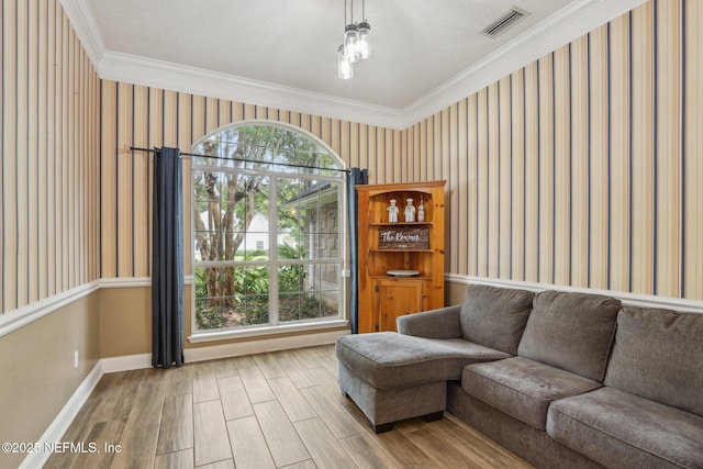 2478 Country Club Blvd, Orange Park, FL 32073 - living room with wallpapered walls, wood finished floors, baseboards, and ornamental molding