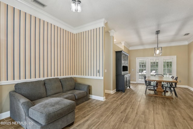 2478 Country Club Blvd, Orange Park, FL 32073 - living room featuring light wood finished floors, baseboards, and ornamental molding