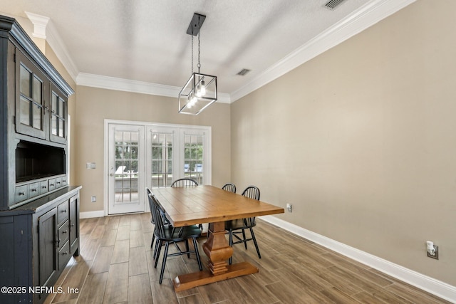 2478 Country Club Blvd, Orange Park, FL 32073 - dining room with baseboards, crown molding, and wood tiled floors