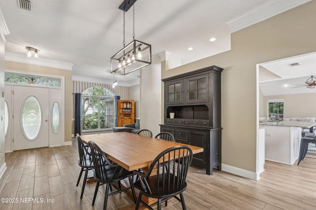 2478 Country Club Blvd, Orange Park, FL 32073 - dining area with ornamental molding, baseboards, light wood finished floors, and recessed lighting