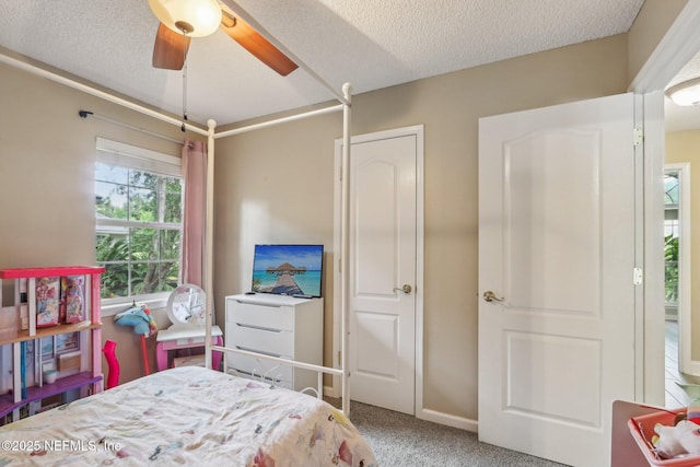 2478 Country Club Blvd, Orange Park, FL 32073 - carpeted bedroom featuring a textured ceiling and a ceiling fan