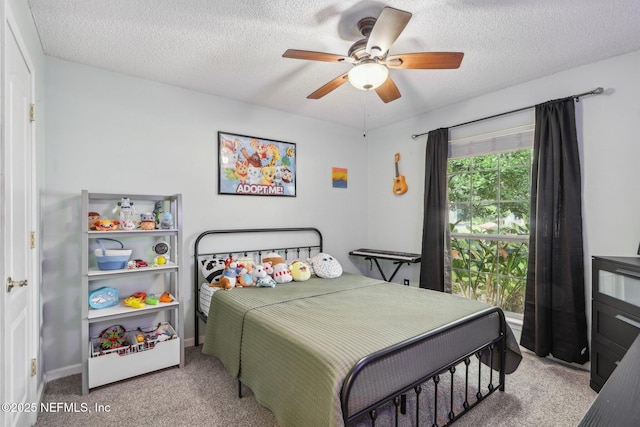2478 Country Club Blvd, Orange Park, FL 32073 - bedroom featuring carpet floors, a textured ceiling, and ceiling fan