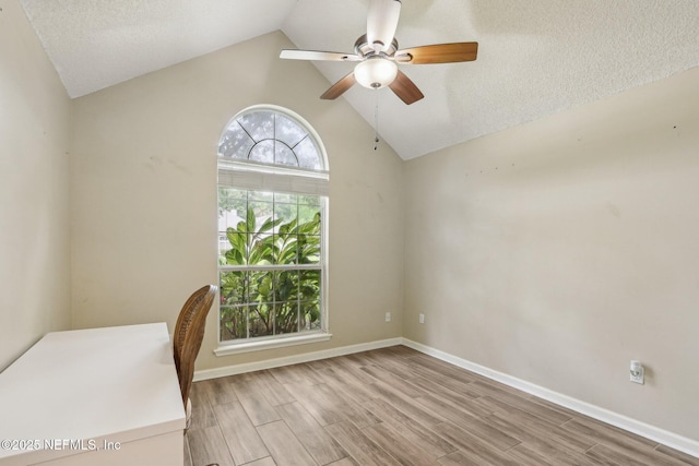 2478 Country Club Blvd, Orange Park, FL 32073 - unfurnished office featuring ceiling fan, lofted ceiling, light wood-style floors, baseboards, and a textured ceiling