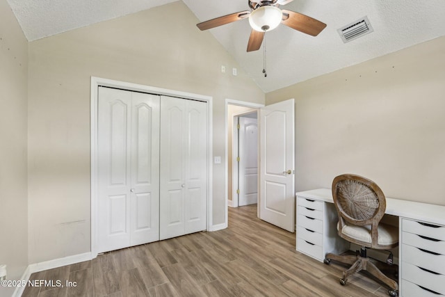 2478 Country Club Blvd, Orange Park, FL 32073 - home office featuring ceiling fan, light wood-type flooring, baseboards, a textured ceiling, and high vaulted ceiling