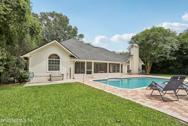 2478 Country Club Blvd, Orange Park, FL 32073 - outdoor pool with a sunroom, a patio area, and a lawn