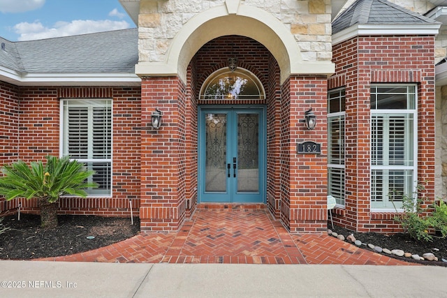 182 Malley Cove Ln, Fleming Island, FL 32003 - doorway to property with french doors and brick siding