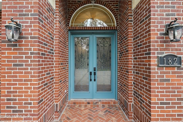 182 Malley Cove Ln, Fleming Island, FL 32003 - entrance to property featuring french doors and brick siding