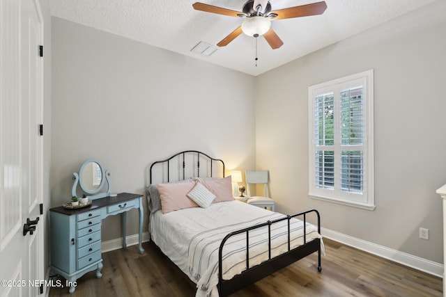 182 Malley Cove Ln, Fleming Island, FL 32003 - bedroom featuring wood finished floors, baseboards, a ceiling fan, and a textured ceiling