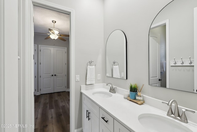 182 Malley Cove Ln, Fleming Island, FL 32003 - full bathroom featuring double vanity, a ceiling fan, and wood finished floors