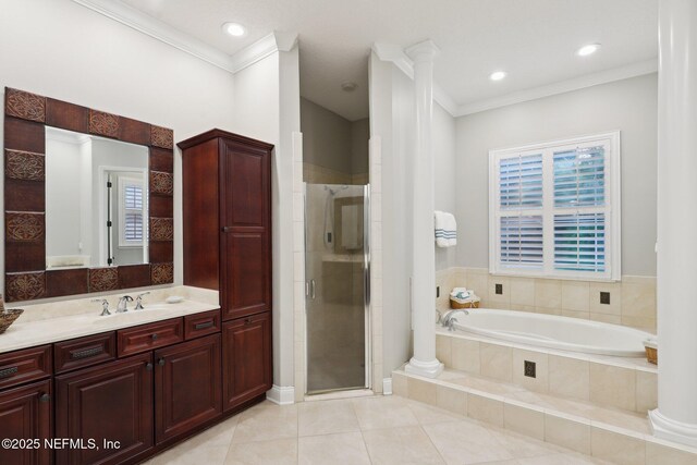 182 Malley Cove Ln, Fleming Island, FL 32003 - bathroom with a bath, vanity, a stall shower, decorative columns, and ornamental molding
