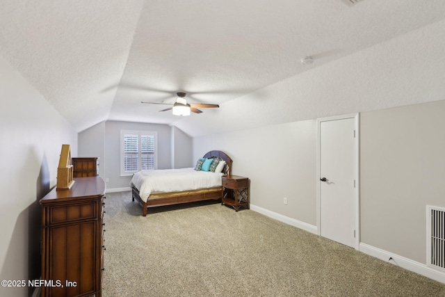 182 Malley Cove Ln, Fleming Island, FL 32003 - carpeted bedroom featuring a textured ceiling, vaulted ceiling, baseboards, and ceiling fan