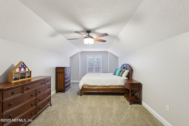182 Malley Cove Ln, Fleming Island, FL 32003 - bedroom with light carpet, vaulted ceiling, baseboards, a textured ceiling, and a ceiling fan