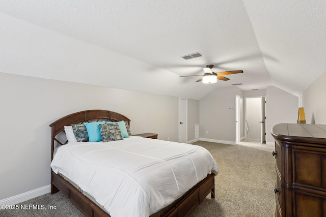 182 Malley Cove Ln, Fleming Island, FL 32003 - bedroom with lofted ceiling, light colored carpet, baseboards, a textured ceiling, and ceiling fan