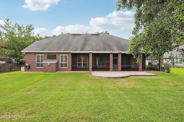 182 Malley Cove Ln, Fleming Island, FL 32003 - back of house with a sunroom, a shingled roof, and brick siding