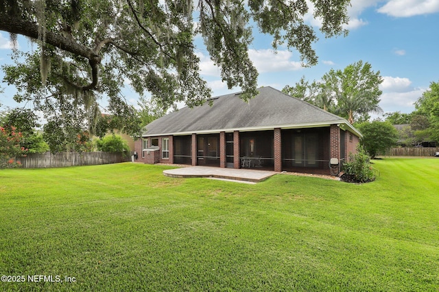 182 Malley Cove Ln, Fleming Island, FL 32003 - rear view of house featuring a sunroom and brick siding