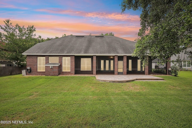 182 Malley Cove Ln, Fleming Island, FL 32003 - back of property featuring a shingled roof, a patio area, and brick siding
