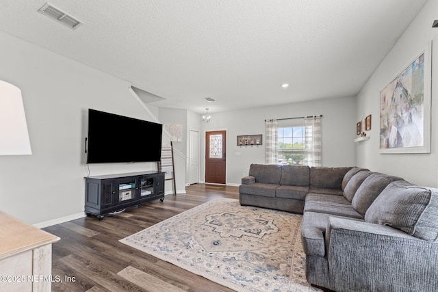1578 Harvest Cove Dr, Middleburg, FL 32068 - living room featuring dark wood-type flooring, recessed lighting, baseboards, and a textured ceiling