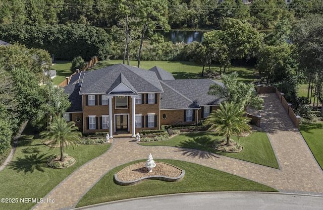 8135 Wekiva Way, Jacksonville, FL 32256 - view of front of property featuring french doors, a front lawn, and a water view