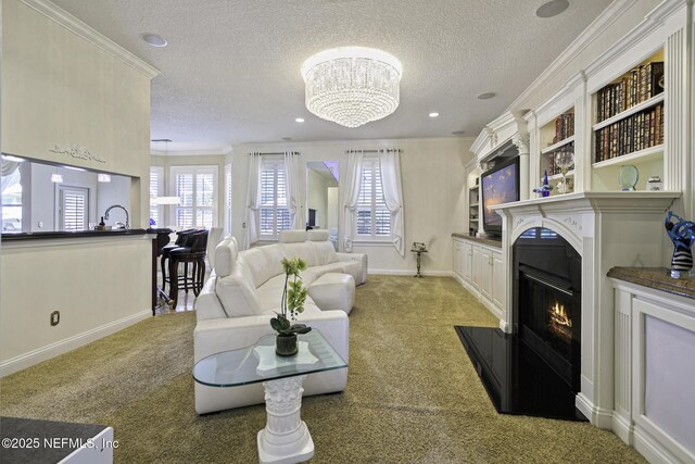 8135 Wekiva Way, Jacksonville, FL 32256 - living room featuring a textured ceiling, ornamental molding, light carpet, a fireplace with flush hearth, and a chandelier